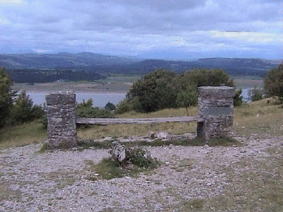Bench set in stone pillars with Lakeland hills behind