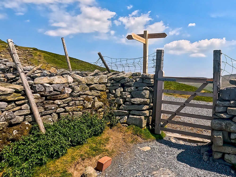 Turn left through the gate to start heading along the Pennine Way to Pen-y-ghent summit