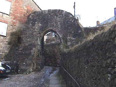 Cobbled path passing through old medieval wall