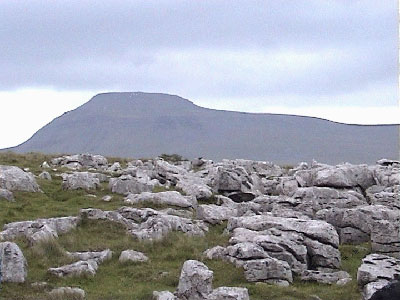 Ingleborough re-appears over the limestone pavement