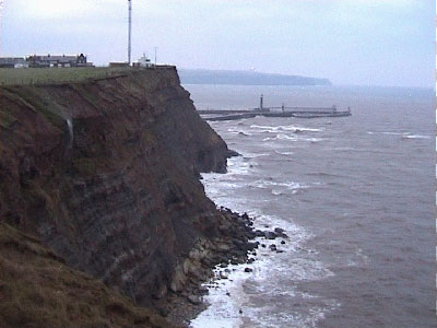 The radio mast with the harbour wall behind