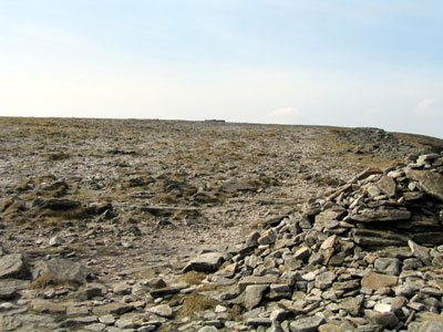 Shelter just visible on the horizon after reaching Ingleborough's Table Top