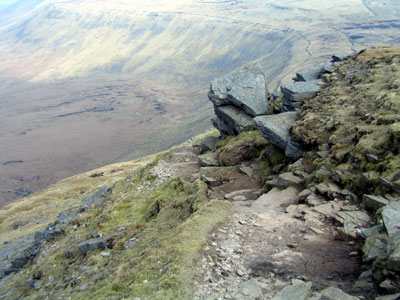 Path passes just to the left of the small cliff