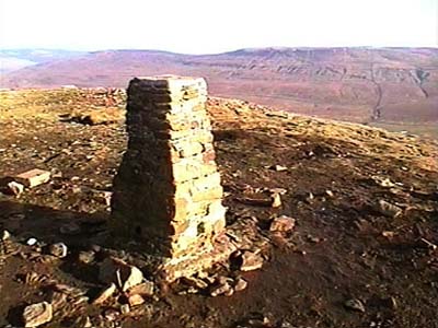 Triangulation point on summit of Pen-y-ghent with Fountains Fell in the background